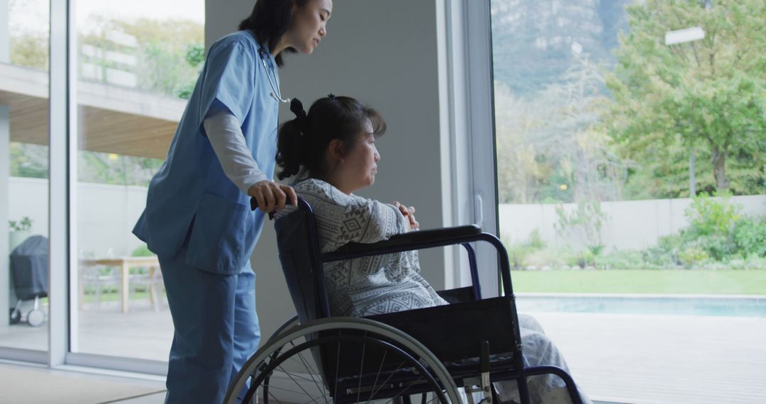 Nurse Caring for Wheelchair-Bound Woman by Large Window - Free Images, Stock Photos and Pictures on Pikwizard.com
