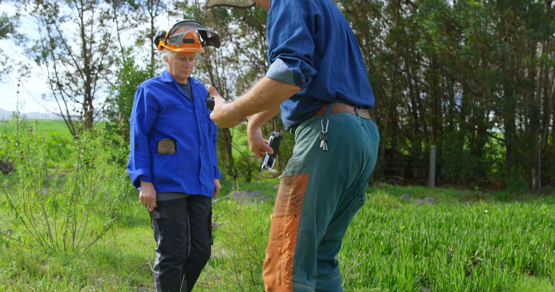 Forest Workers Preparing for Outdoor Task - Free Images, Stock Photos and Pictures on Pikwizard.com