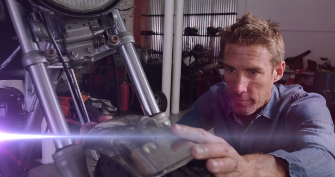 Mechanic Repairing Motorcycle with Digital Light Effects