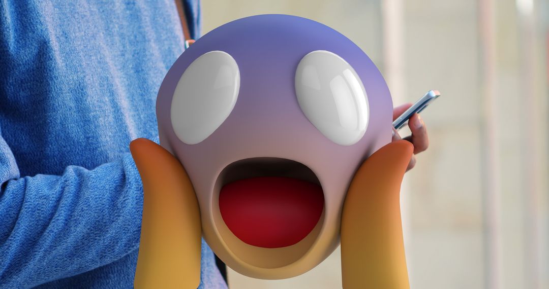Excited Emoticon Superimposed on Smartphone User