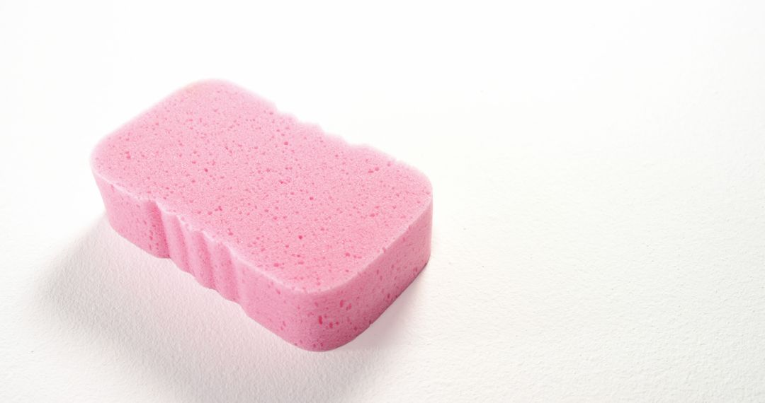 Close-Up of Pink Cleaning Sponge on White Background - Free Images, Stock Photos and Pictures on Pikwizard.com