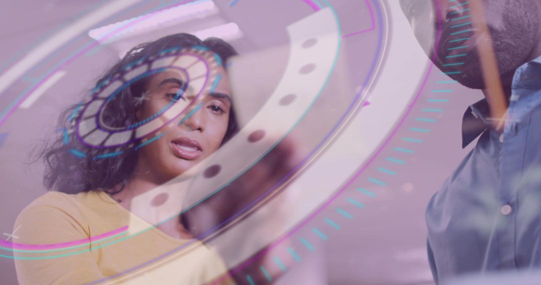 Innovative team using futuristic holographic technology in office