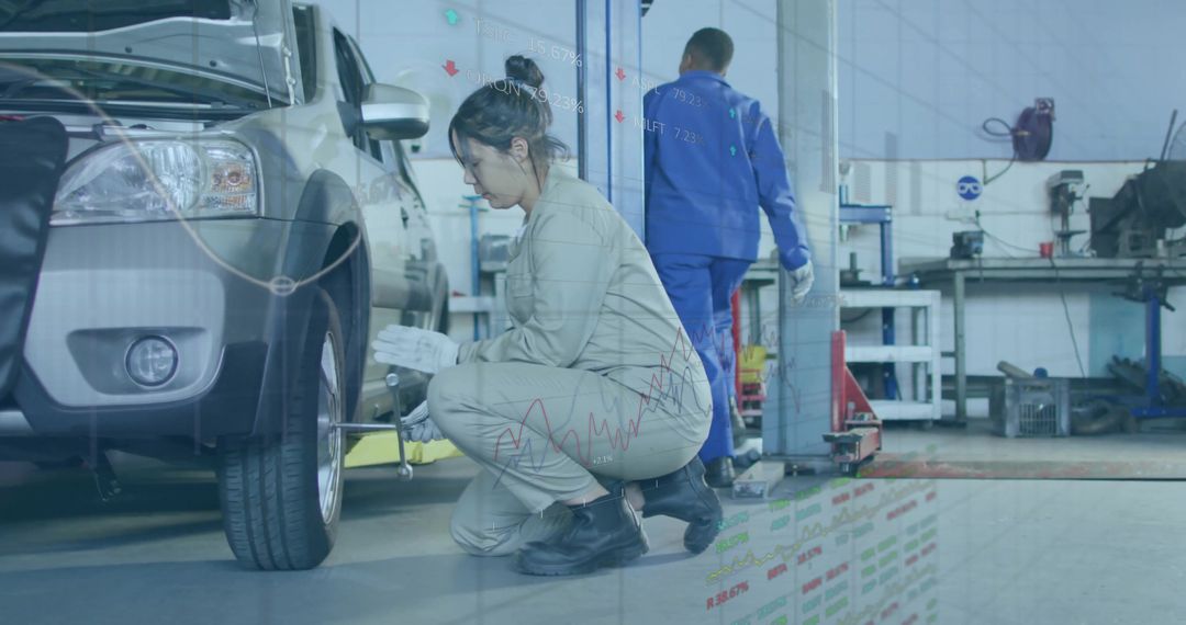 Crouching Mechanic Loosening Lug Nuts on SUV with Data Overlay