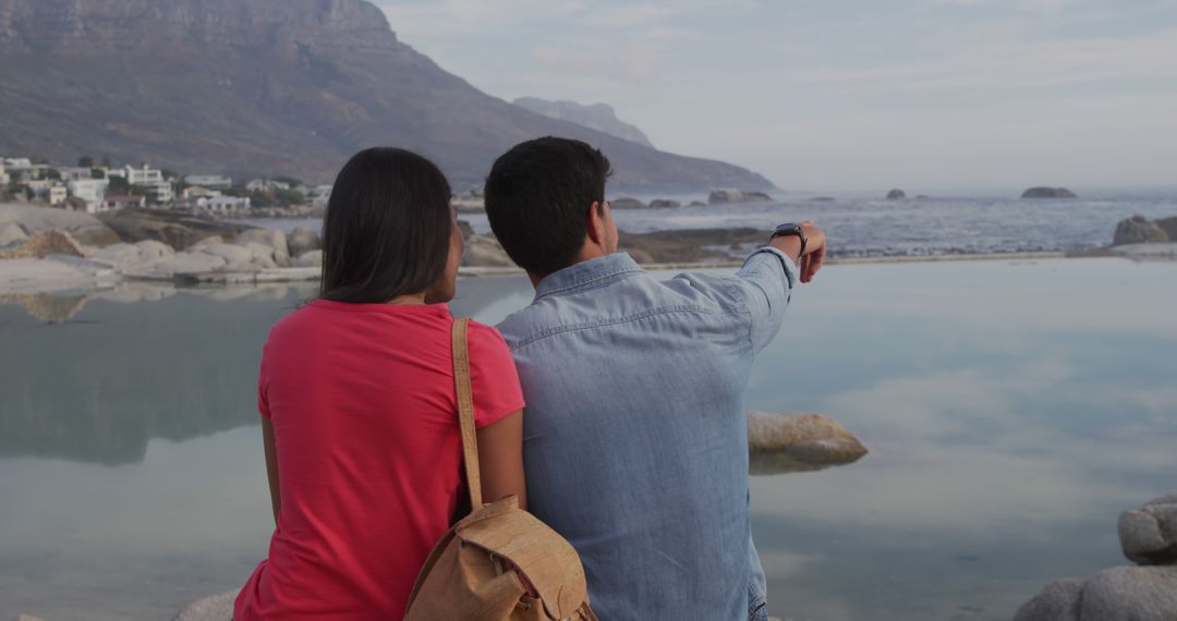 Couple Enjoying Scenic Ocean View Together - Free Images, Stock Photos and Pictures on Pikwizard.com