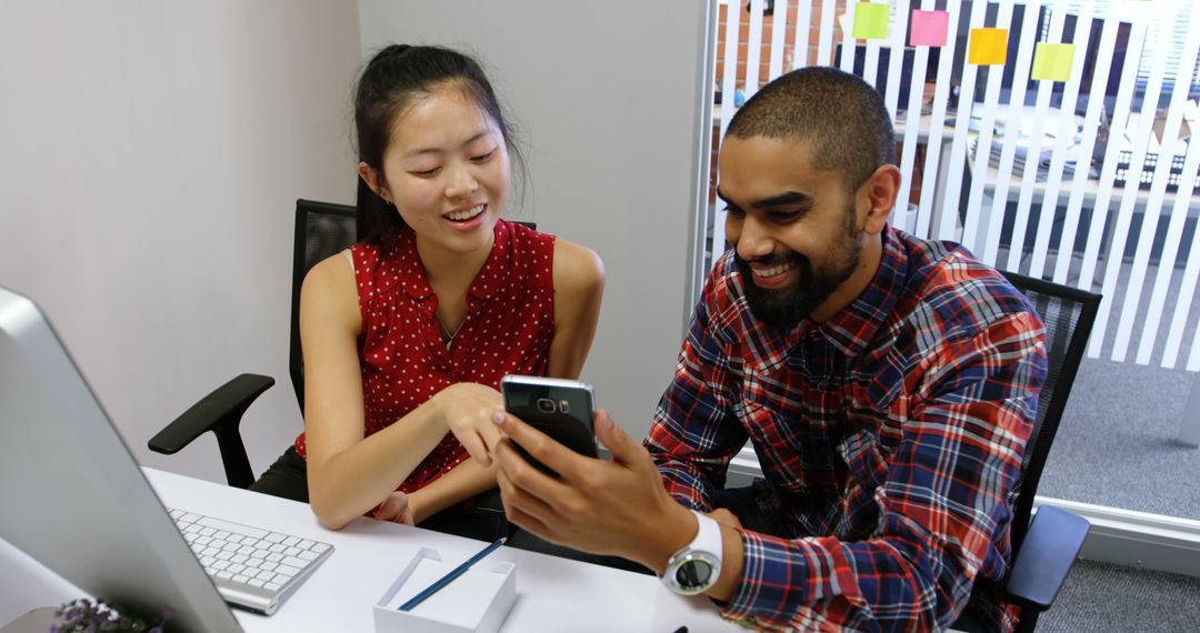 Smiling Colleagues Collaborating in Modern Office