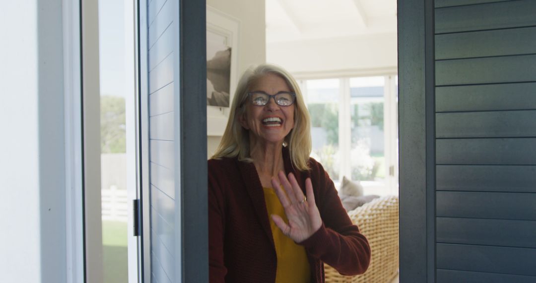 Image of happy caucasian senior woman opening door and welcoming someone - Free Images, Stock Photos and Pictures on Pikwizard.com