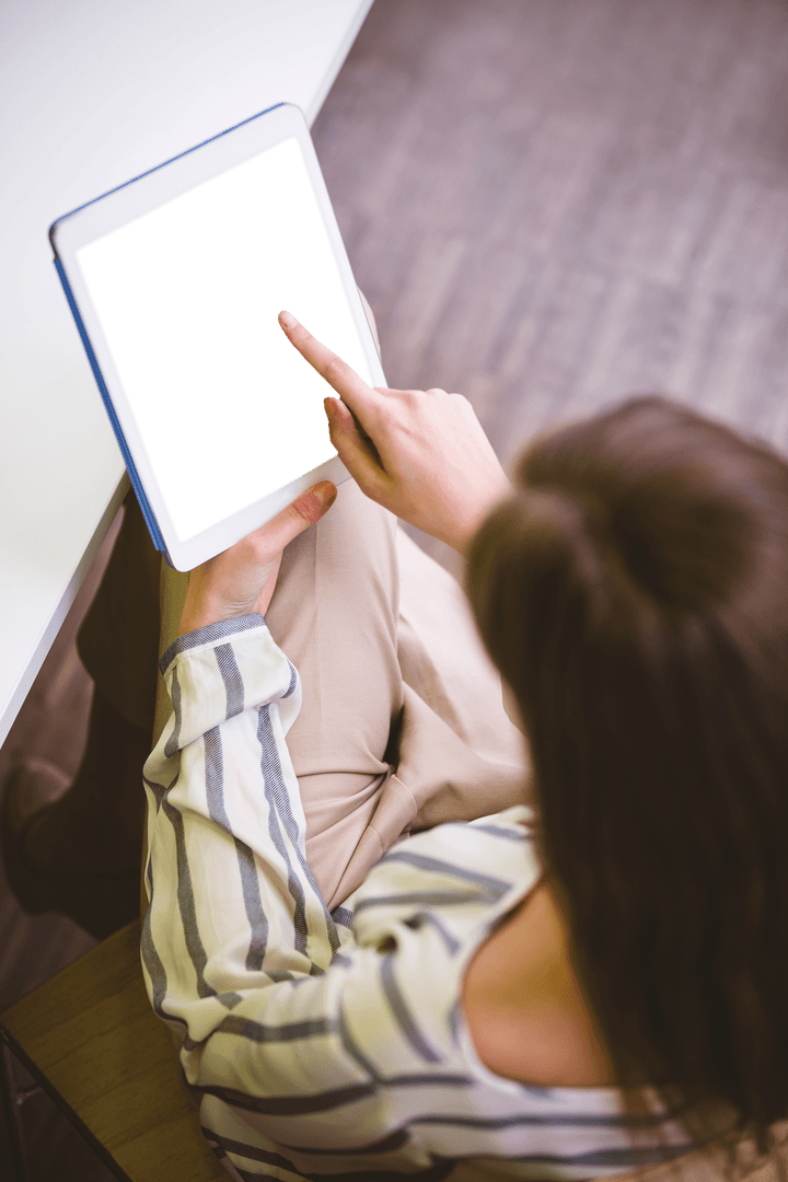 High Angle Transparent Screen Tablet Usage by Businesswoman