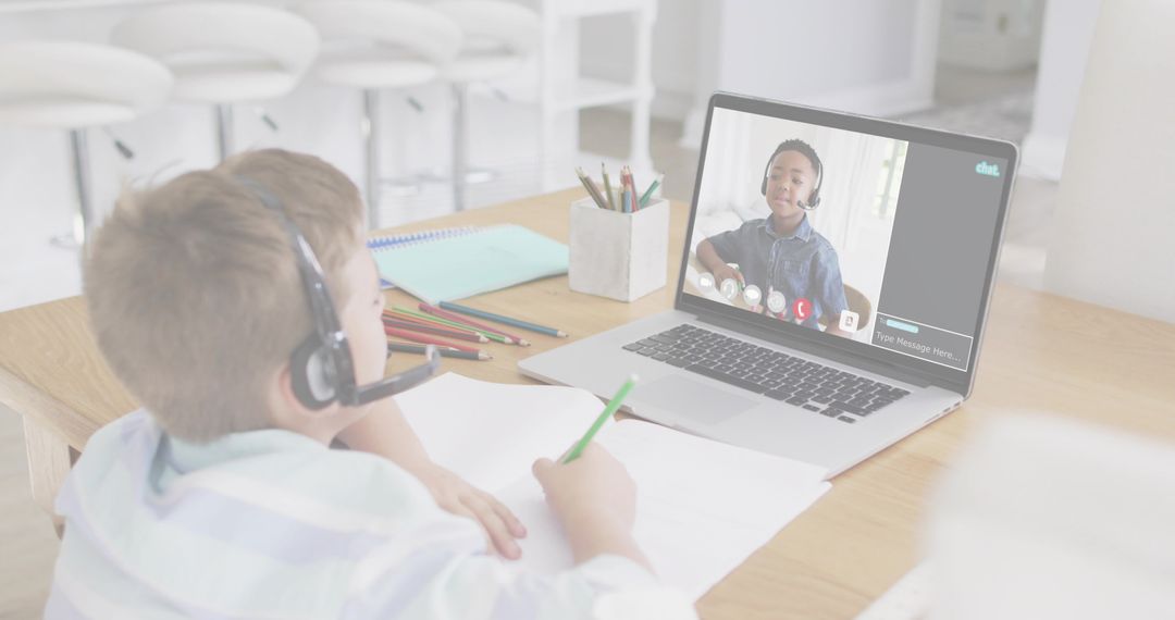 Boy Engaging in Online Learning Session with Headset