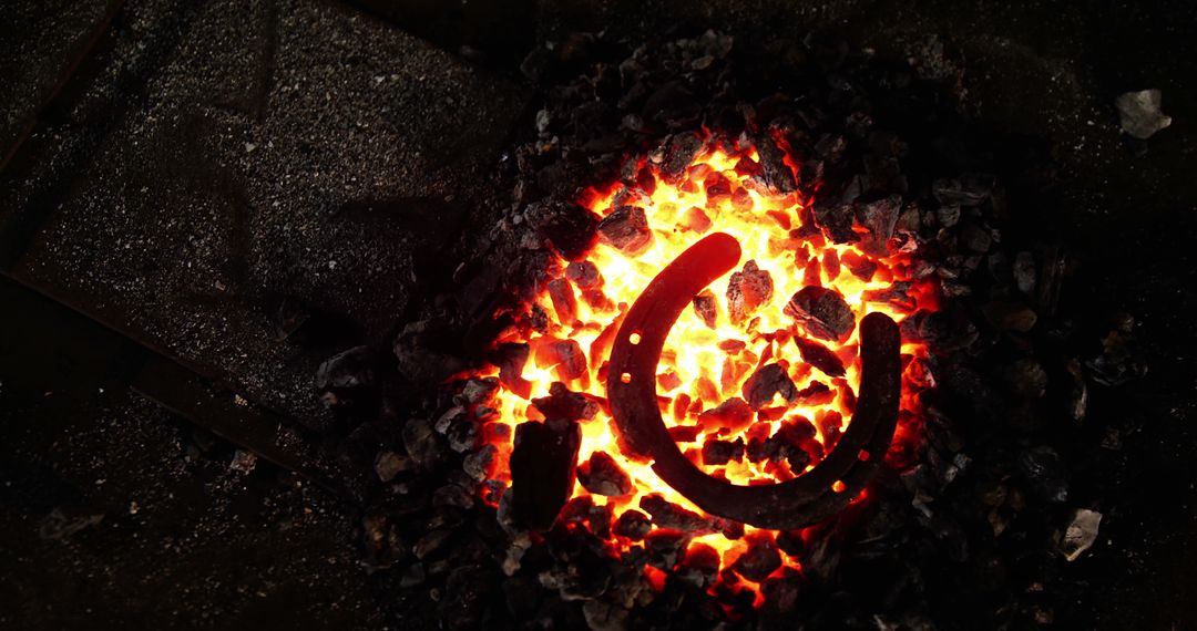 Glowing Horseshoe Heating in a Workshop Forge