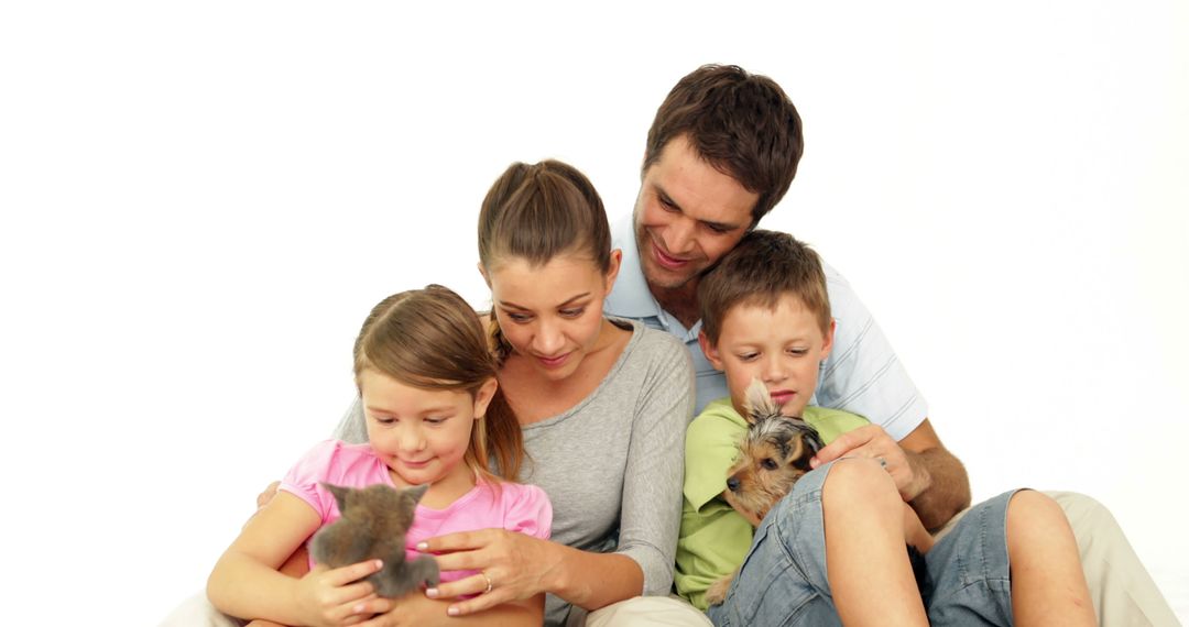 Happy Family With Kitten and Puppy at Home