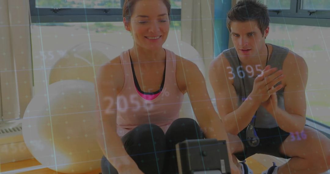 Personal Trainer Guiding Woman Rowing with Digital Progress Overlay