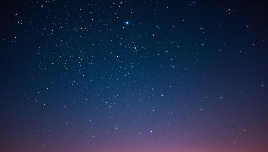 Vast Starry Night Sky Showing Twinkling Stars and Indigo-Pink Horizon Glow