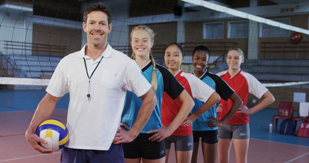 Volleyball Coach with Enthusiastic Female Team in Gym - Free Images, Stock Photos and Pictures on Pikwizard.com