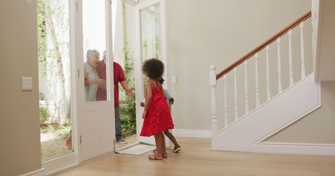 Children Greeting Grandparents at Front Door - Free Images, Stock Photos and Pictures on Pikwizard.com