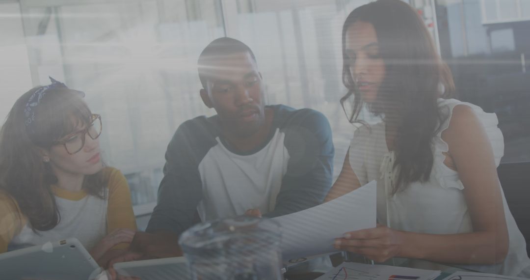 Diverse Team Collaborating on Financial Project in Bright Office