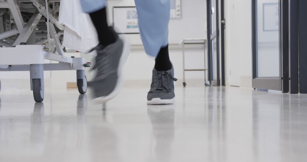 Abstract View of Healthcare Worker Walking in Hospital Corridor - Free Images, Stock Photos and Pictures on Pikwizard.com