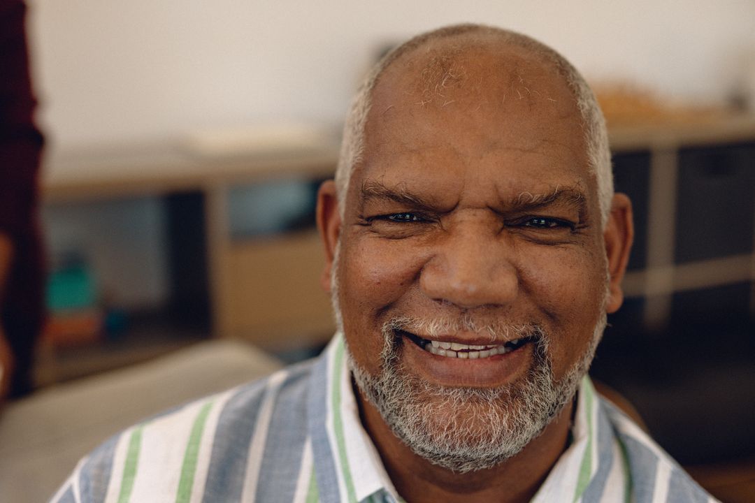 Close-up portrait of smiling biracial senior man with beard in nursing home - Free Images, Stock Photos and Pictures on Pikwizard.com