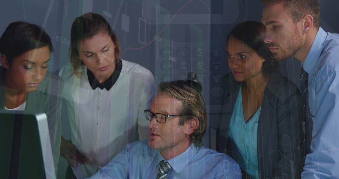 Diverse Business Team Analyzing Data on Computer