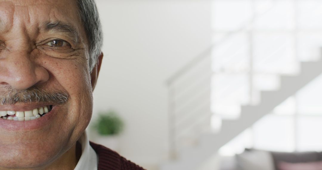 Close-Up of Elderly Man Smiling Indoors - Free Images, Stock Photos and Pictures on Pikwizard.com