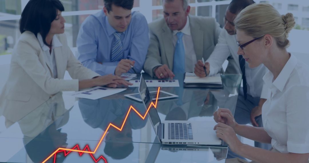 Diverse Business Meeting Analyzing Growth Strategy Data