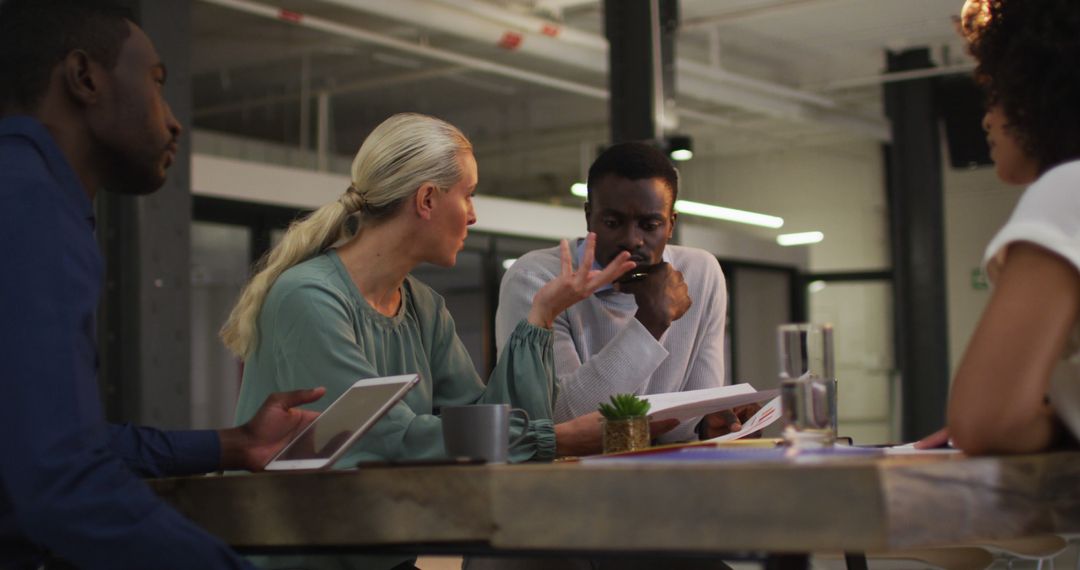 Diverse Business Team Meeting with Technology and Discussion