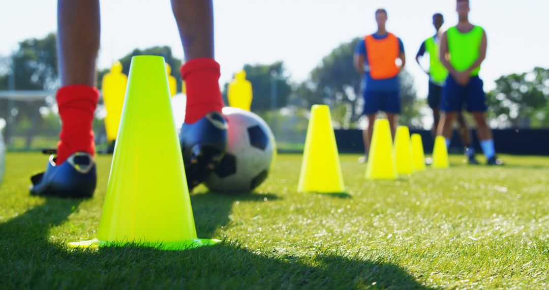 Soccer Players Training on Field with Cones and Ball - Free Images, Stock Photos and Pictures on Pikwizard.com