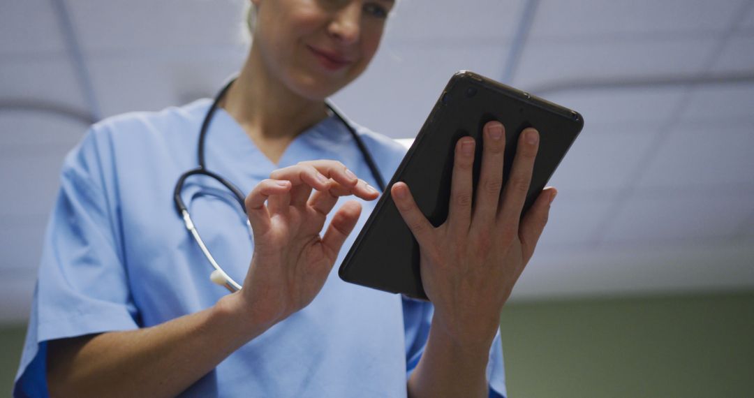 Nurse Using Digital Tablet in Hospital Room for Patient Care - Free Images, Stock Photos and Pictures on Pikwizard.com