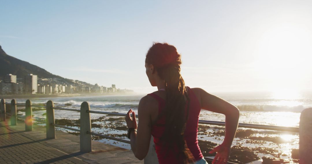 Woman Jogging along Coastal Path at Sunrise - Free Images, Stock Photos and Pictures on Pikwizard.com