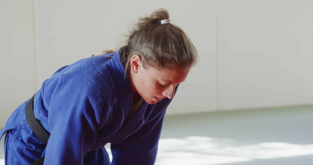 Female Judo Fighter Practicing on Mat - Free Images, Stock Photos and Pictures on Pikwizard.com