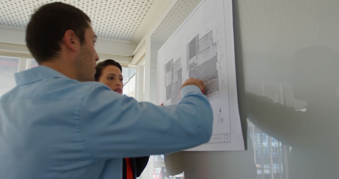 Engineers Discussing Project Blueprint on Whiteboard in Office - Free Images, Stock Photos and Pictures on Pikwizard.com