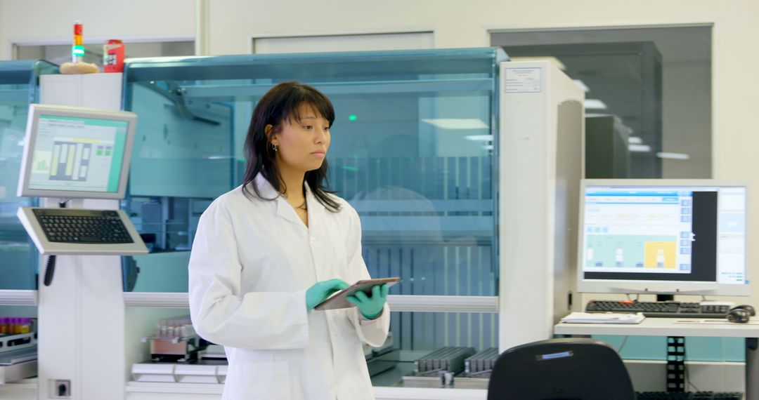 Female Scientist in Modern Laboratory Holding Digital Tablet - Free Images, Stock Photos and Pictures on Pikwizard.com