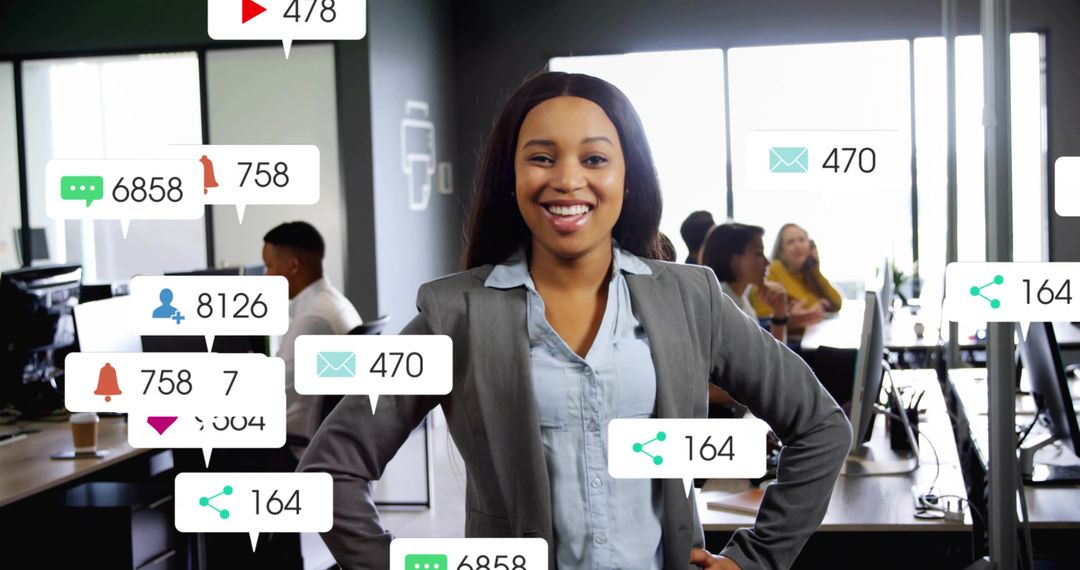 Confident businesswoman leading team in open-plan office with floating digital alerts