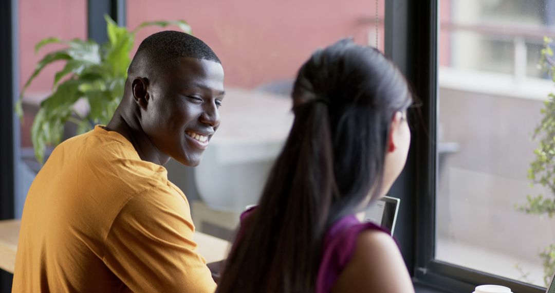 Diverse Professionals Collaborating Enthusiastically in Office Workspace