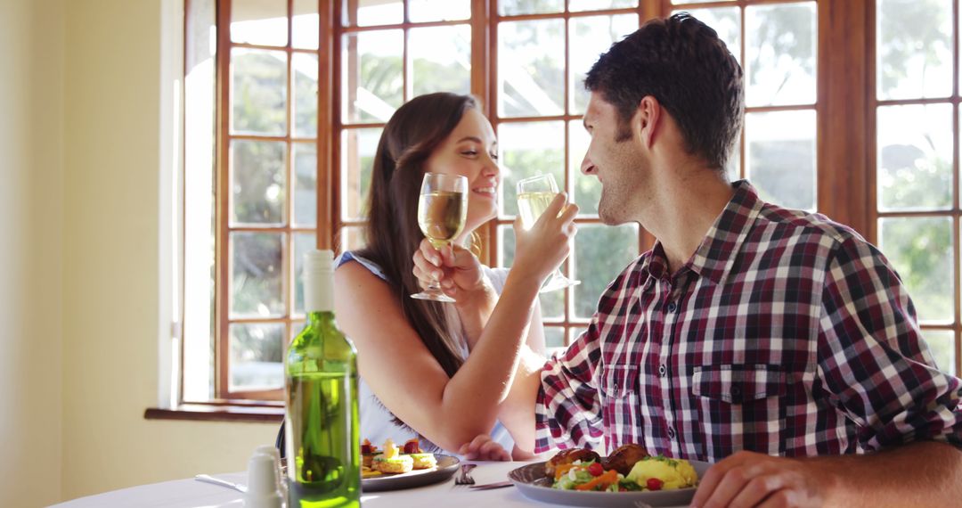 Romantic Lunch Toast with Champagne in Bright Restaurant