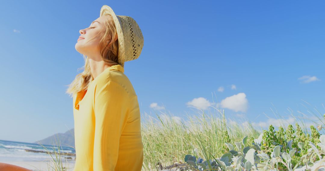 Woman Enjoying Sun on Beach in Summer - Free Images, Stock Photos and Pictures on Pikwizard.com