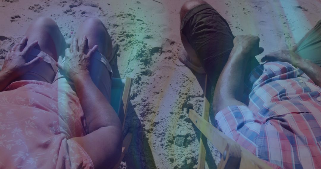 Relaxed Seniors Enjoying Beach Time with Smartphone