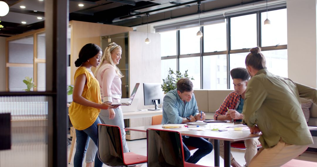 Diverse Team Collaborates in Modern Office Environment