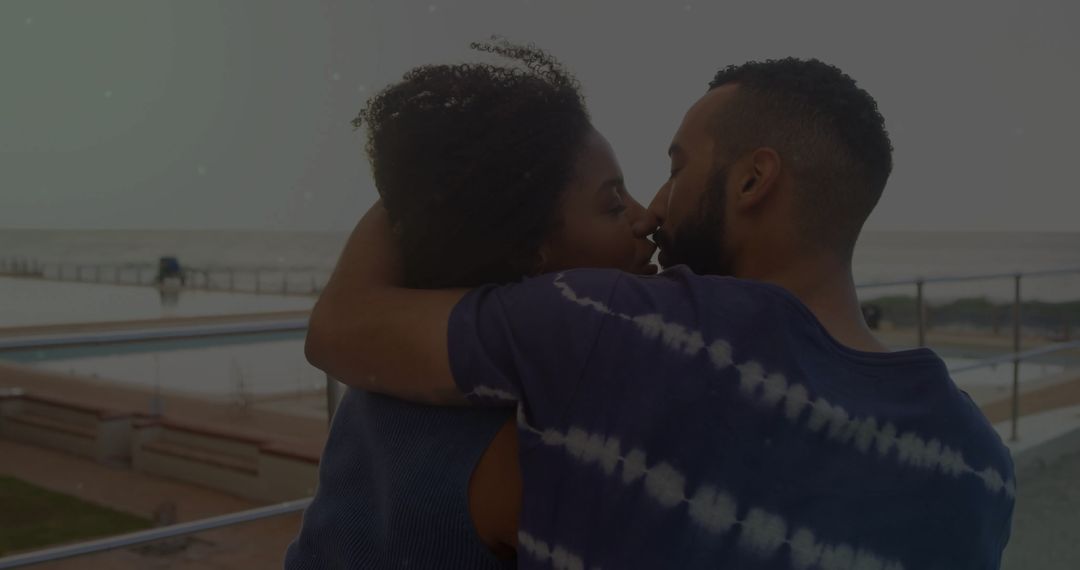 Romantic Couple Embracing Seaside Walkway