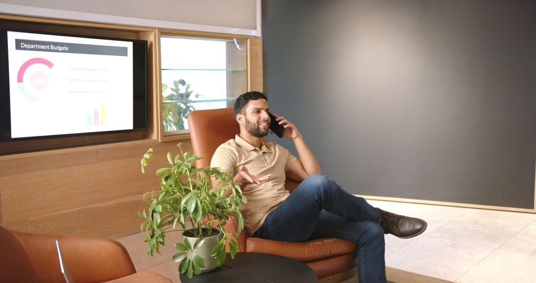 Business Professional Talking on Smartphone in Stylish Office