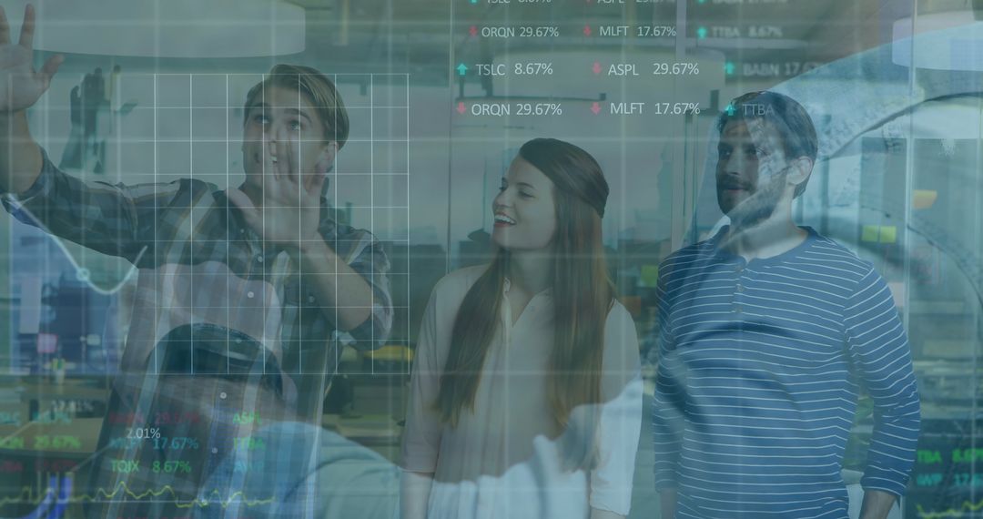 Professionals Analyzing Data Charts on Transparent Screen in Modern Office