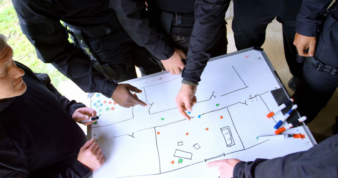 Team Collaborating on Tactical Planning Using Whiteboard - Free Images, Stock Photos and Pictures on Pikwizard.com