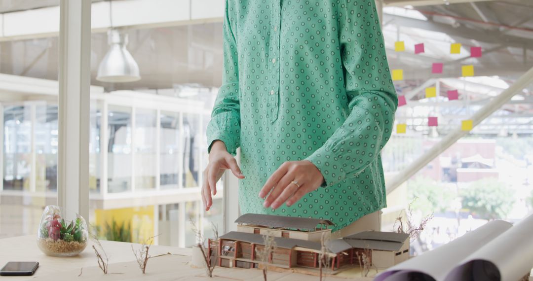 Architect Reviewing Scaled Building Model In Modern Office - Free Images, Stock Photos and Pictures on Pikwizard.com