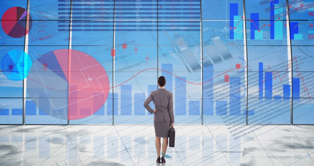 Businesswoman Analyzing Virtual Financial Data Charts and Graphs
