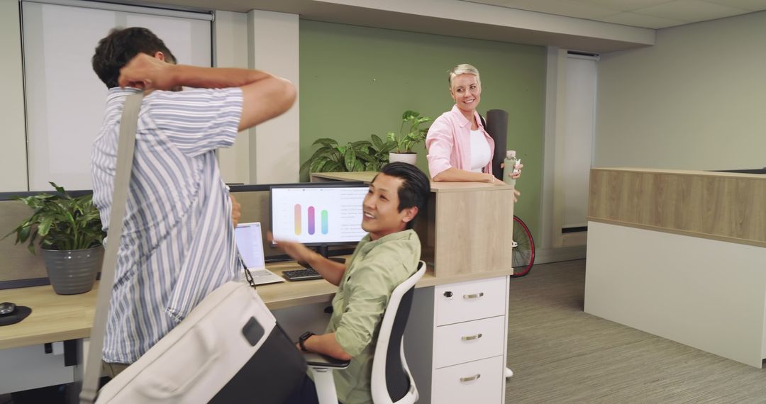 Diverse Coworkers Engaging in Informal Office Activity