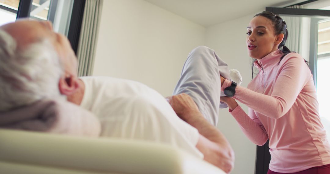 Female Physical Therapist Assisting Elderly Man with Rehabilitation Exercises - Free Images, Stock Photos and Pictures on Pikwizard.com