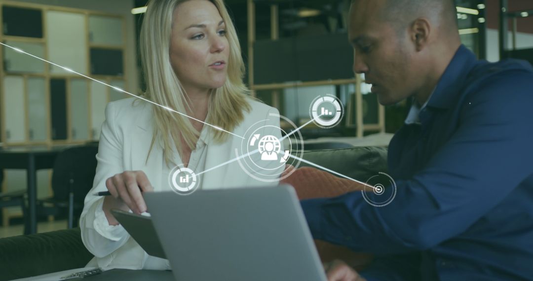 Diverse Colleagues Discussing Digital Strategy in Modern Office