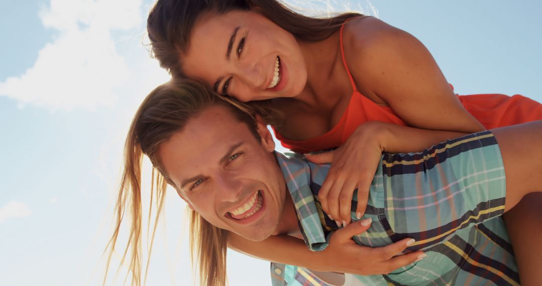 Happy Couple Enjoying Summer Day Outdoors with Joyful Expressions
