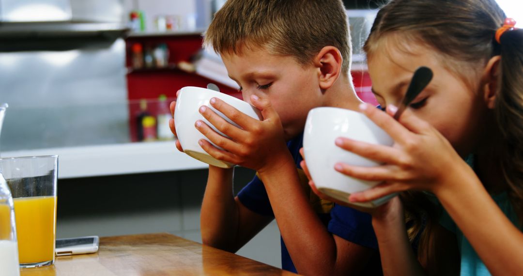 Children Drinking Soup in Kitchen - Free Images, Stock Photos and Pictures on Pikwizard.com