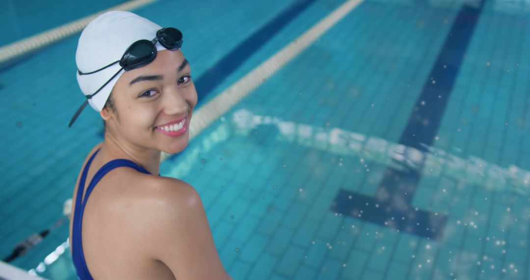 Smiling Female Swimmer Resting by Poolside in Swimwear