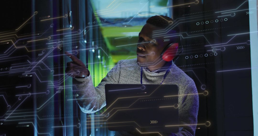 IT Technician Analyzing Data in Modern Server Room